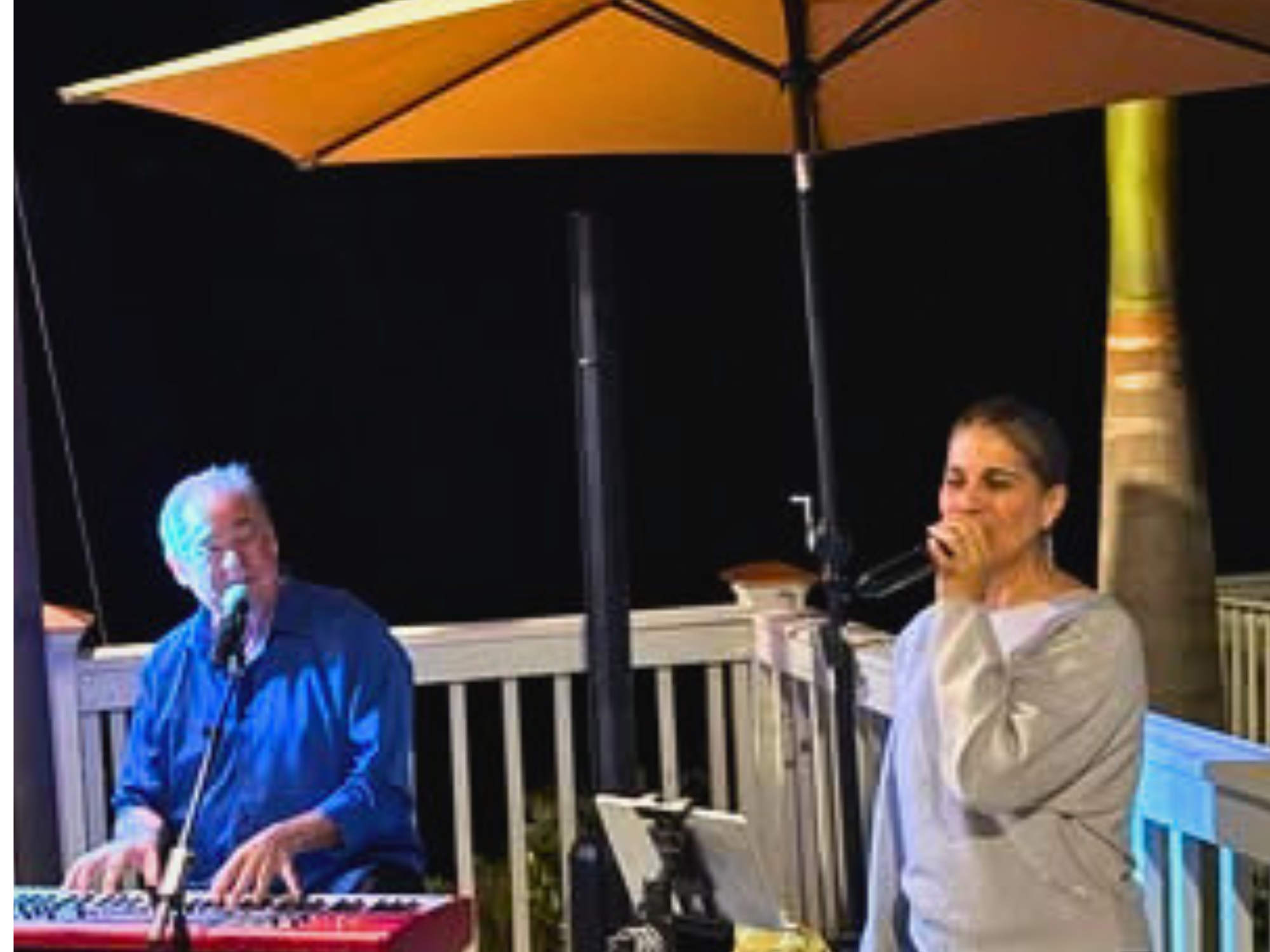 Deano and Marvilla performing outdoors